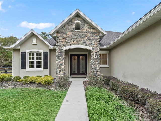 view of exterior entry featuring french doors