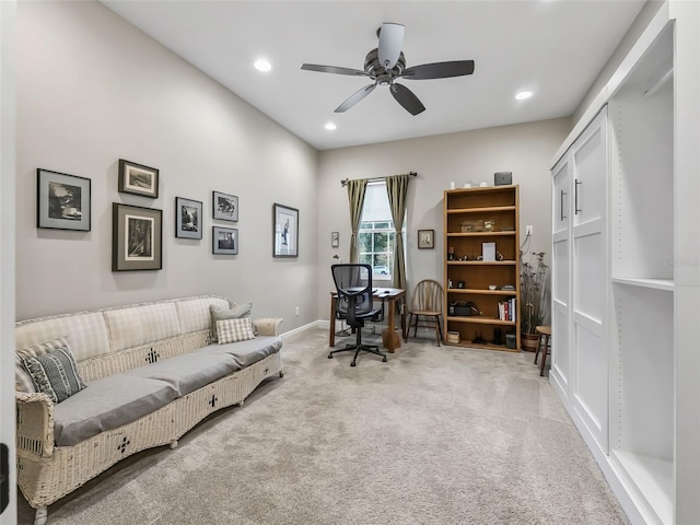 carpeted home office with ceiling fan