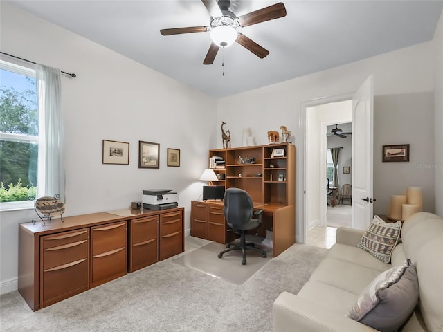 office area featuring light carpet