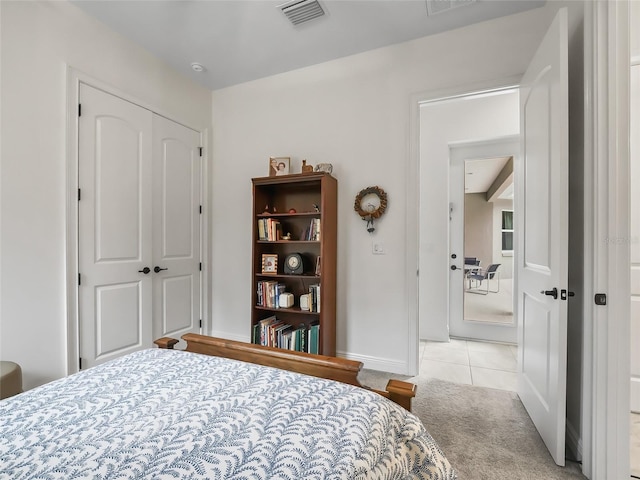 carpeted bedroom with a closet