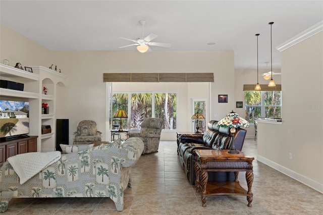 tiled living room featuring ceiling fan