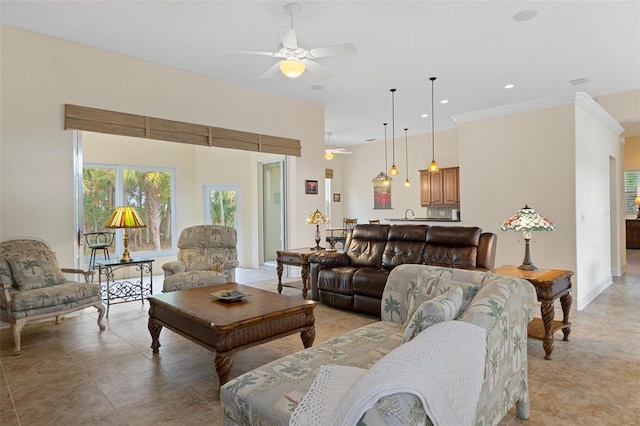 living room featuring ceiling fan, light tile patterned flooring, and ornamental molding