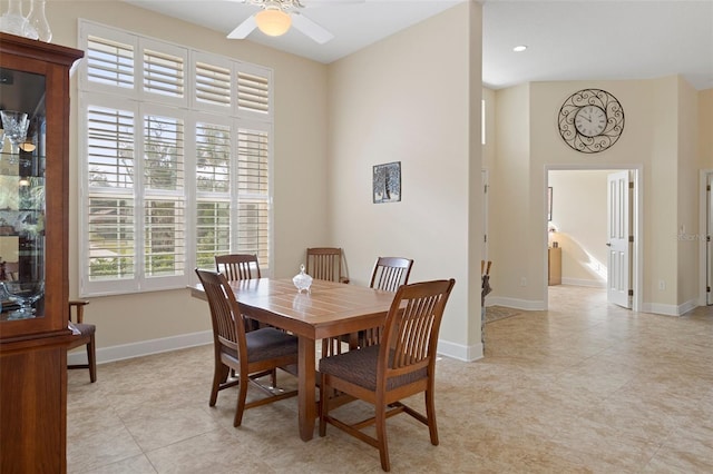 dining area with ceiling fan and light tile patterned floors