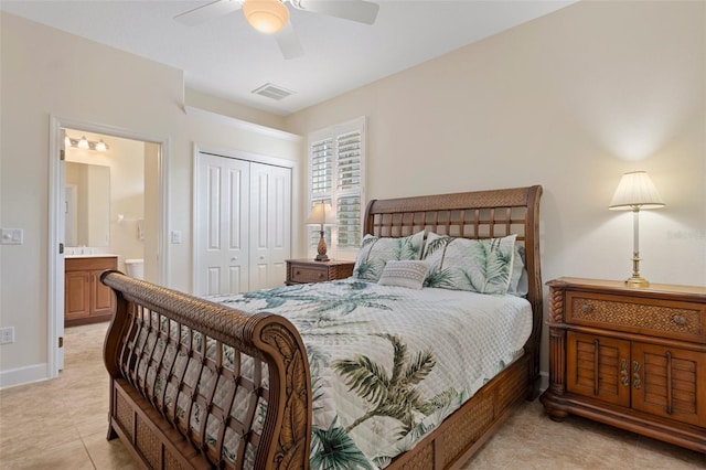 tiled bedroom with ensuite bath, a closet, and ceiling fan