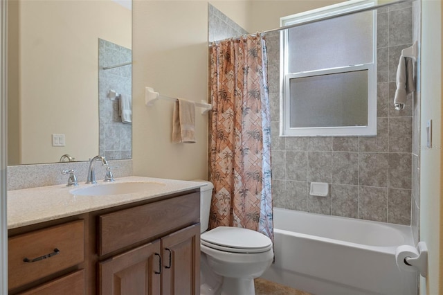 full bathroom featuring shower / bath combo with shower curtain, vanity, and toilet