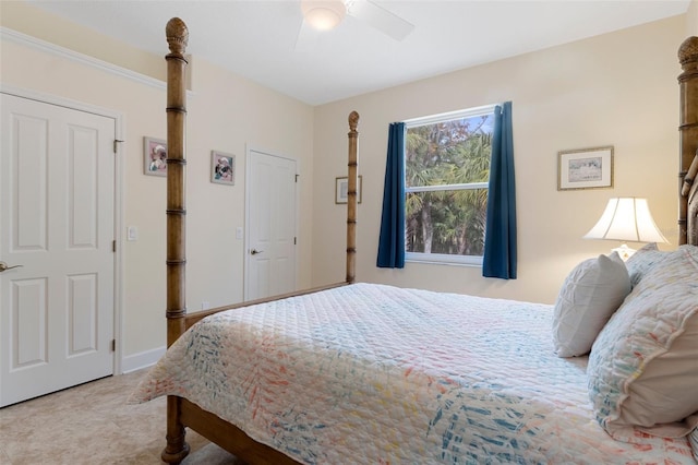 bedroom with ceiling fan and light colored carpet