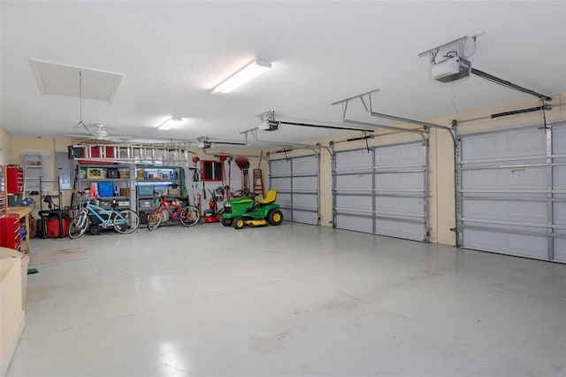 garage featuring ceiling fan and a garage door opener