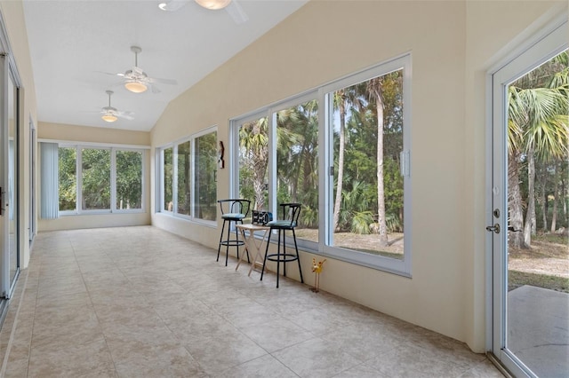 unfurnished sunroom featuring a wealth of natural light and lofted ceiling