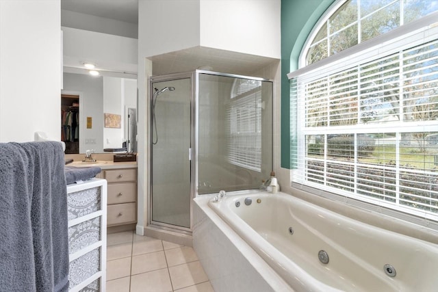 bathroom with vanity, tile patterned floors, a wealth of natural light, and independent shower and bath