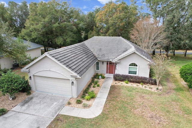 ranch-style home with a front yard and a garage