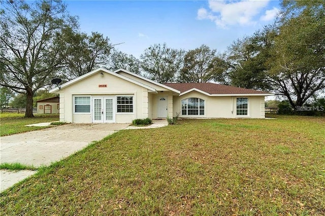 ranch-style house featuring a front yard