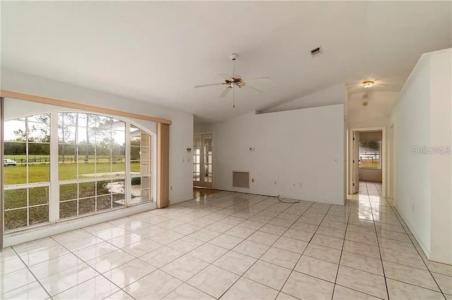 tiled spare room with ceiling fan and vaulted ceiling