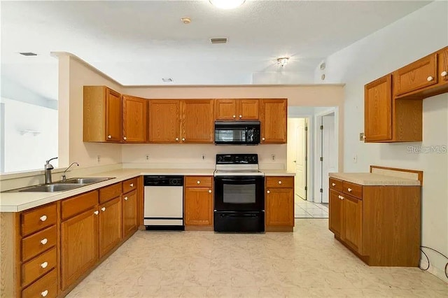 kitchen featuring sink and black appliances