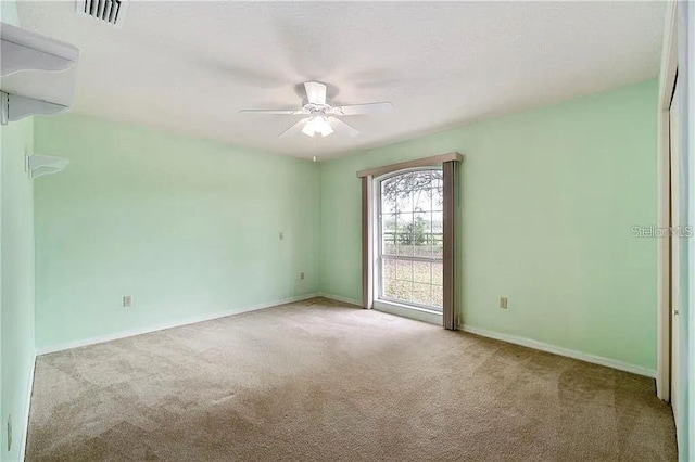 empty room with light carpet and ceiling fan