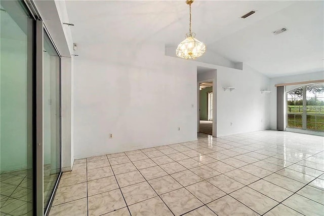 tiled spare room featuring lofted ceiling and an inviting chandelier