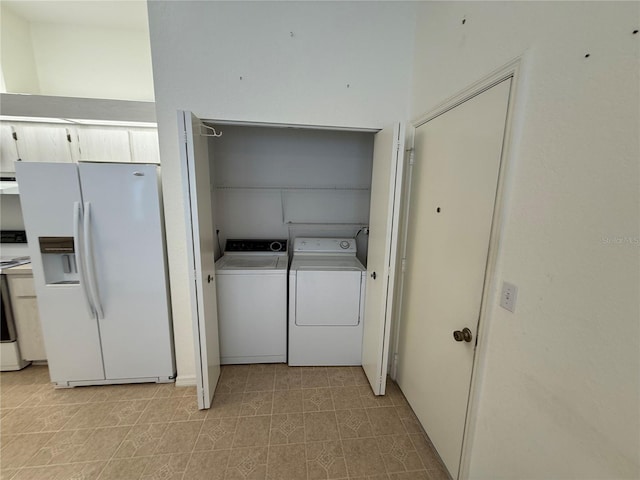 clothes washing area with independent washer and dryer