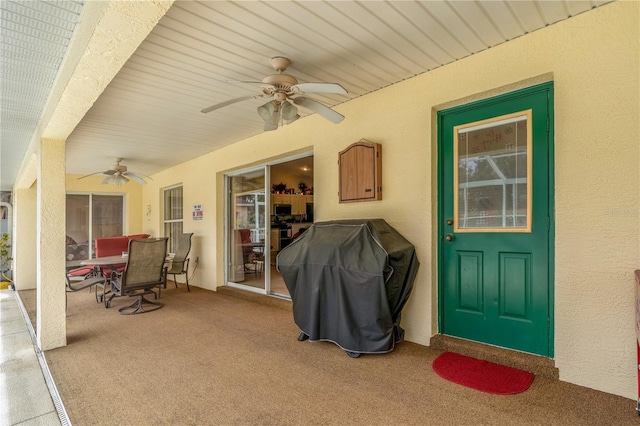 view of patio with ceiling fan and area for grilling