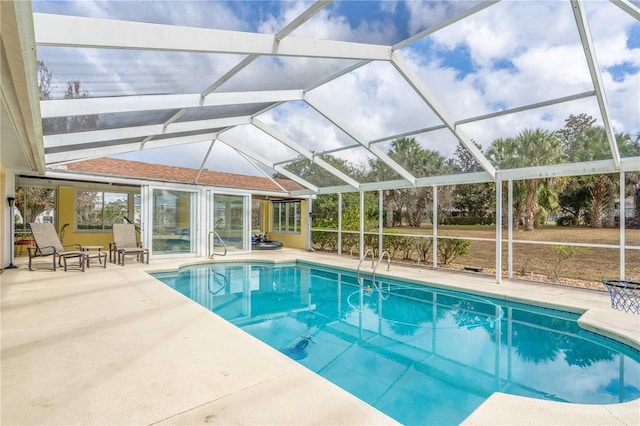 view of pool featuring a lanai and a patio