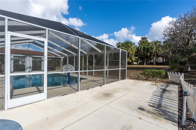 view of patio / terrace with a lanai