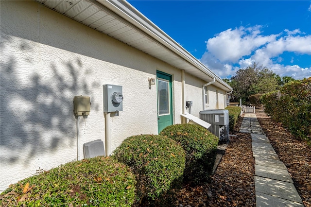 view of home's exterior with central AC