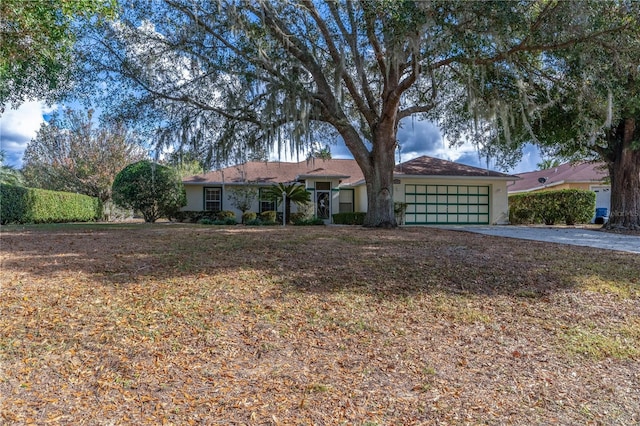 ranch-style house featuring a garage