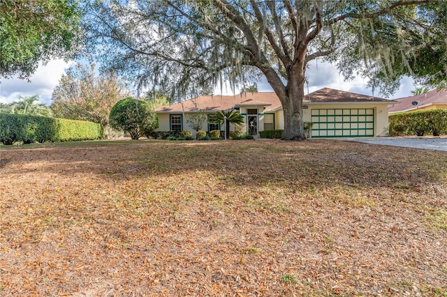 single story home featuring a garage