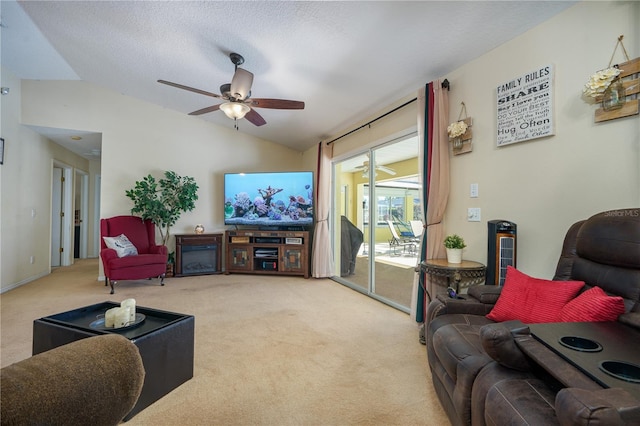 carpeted living room featuring a textured ceiling, ceiling fan, and lofted ceiling