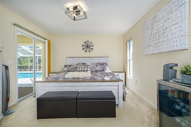 carpeted bedroom featuring access to exterior