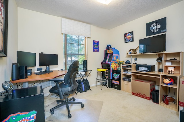 carpeted home office with a textured ceiling