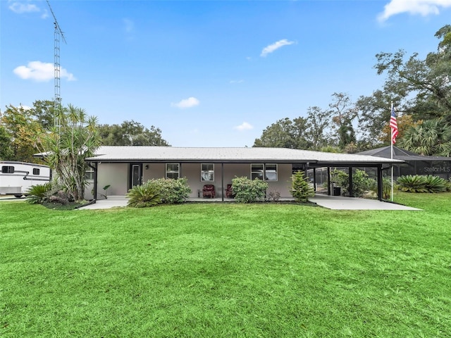 back of house featuring a yard