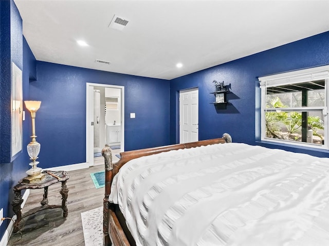 bedroom featuring hardwood / wood-style flooring