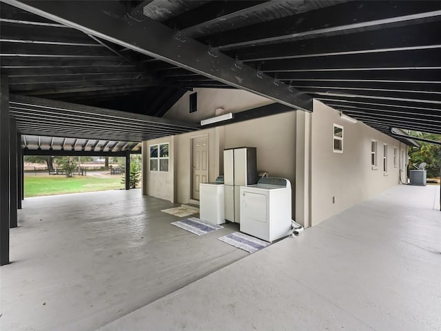 garage with central AC and washer / dryer