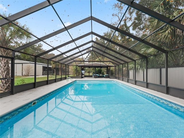 view of pool with a lanai and a patio