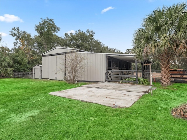 view of outbuilding with a lawn