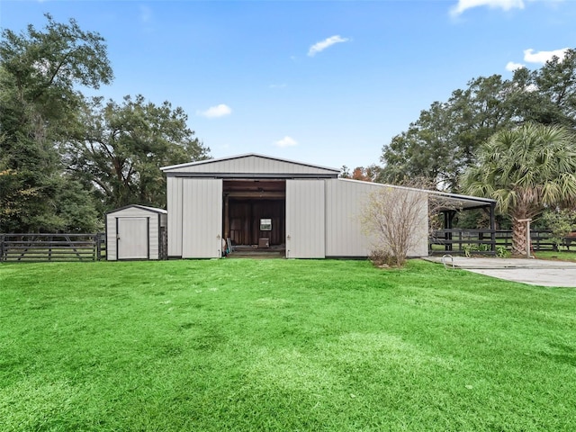 view of outbuilding with a yard