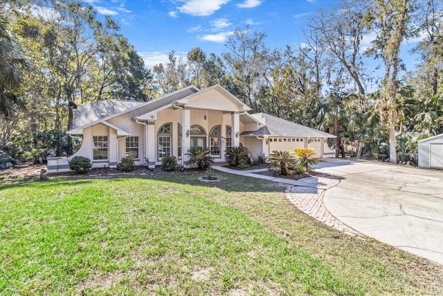 single story home with a garage and a front yard