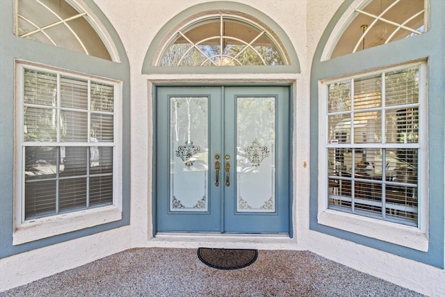 entrance to property featuring french doors