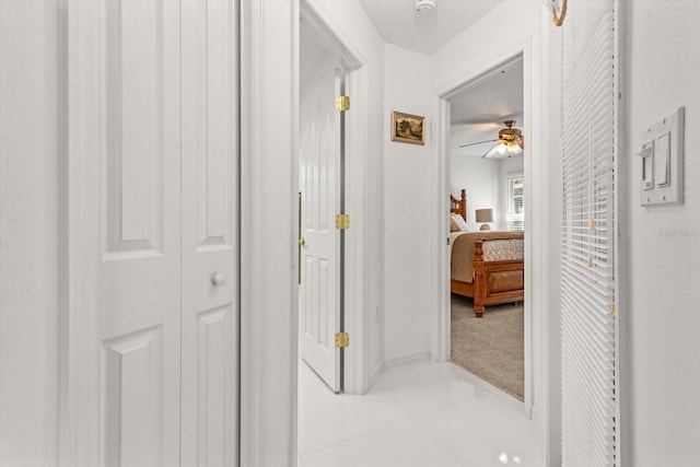 corridor with light tile patterned floors