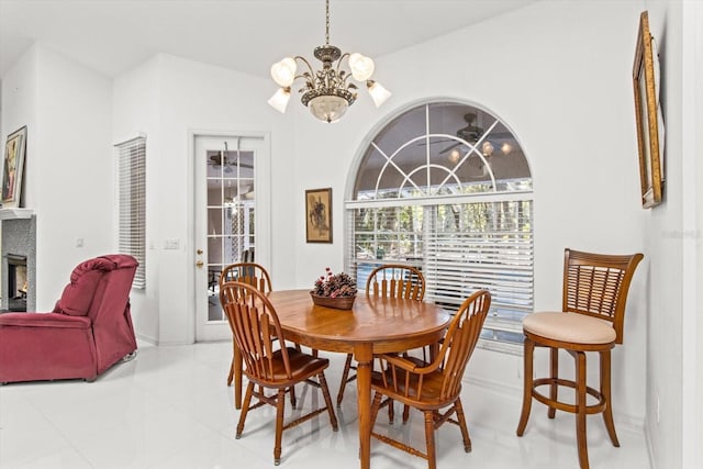 dining room with light tile patterned floors and an inviting chandelier