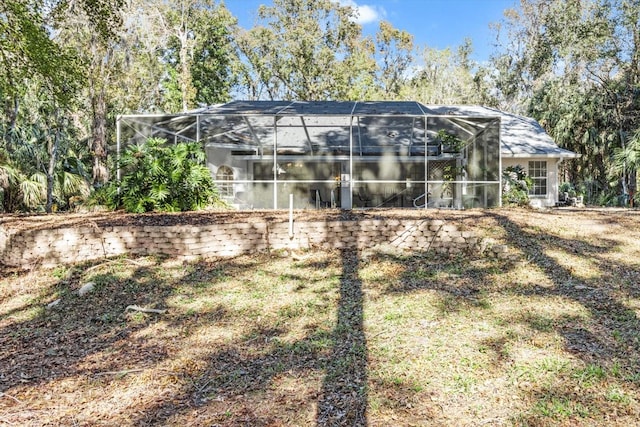 back of property with glass enclosure