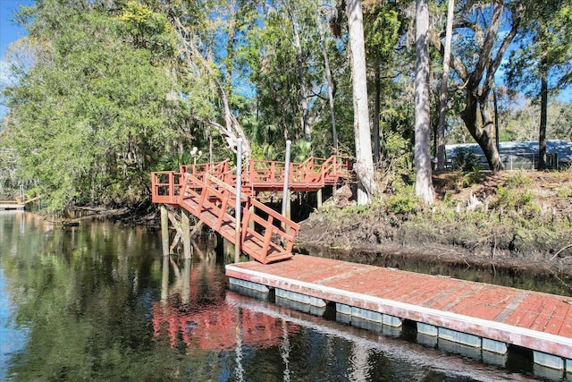 view of dock with a water view