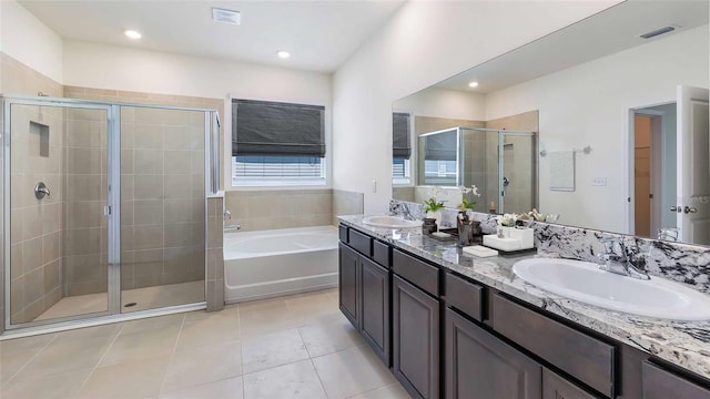 bathroom with separate shower and tub, tile patterned floors, and vanity