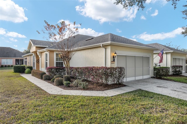 view of side of property with a garage and a lawn