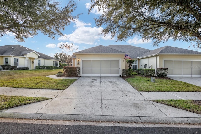 single story home with a front yard and a garage