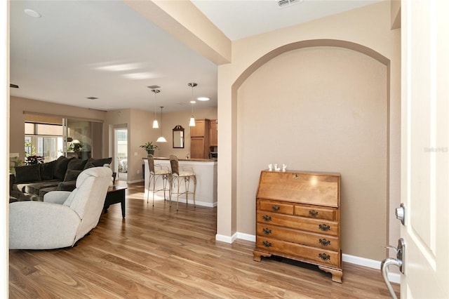 living room with light hardwood / wood-style flooring