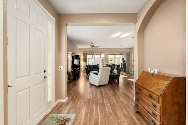 foyer featuring ceiling fan and light hardwood / wood-style floors