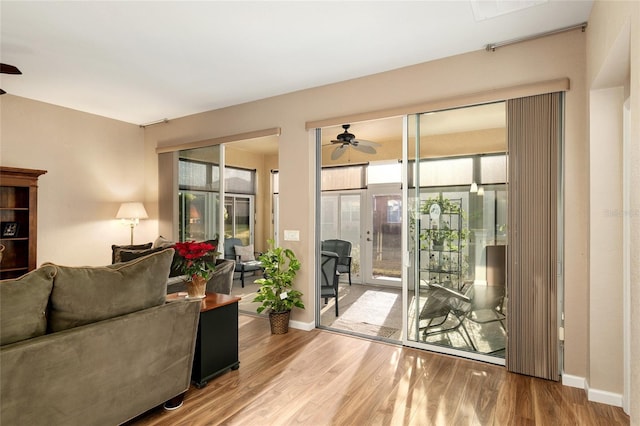 interior space with ceiling fan and light hardwood / wood-style floors