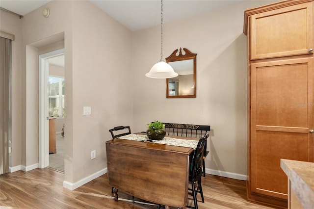 dining area with light hardwood / wood-style flooring