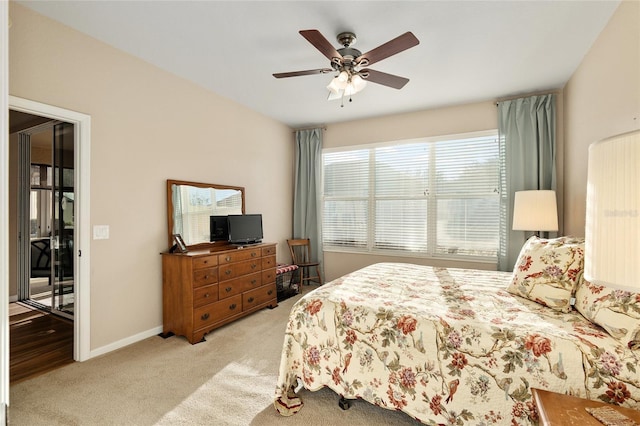 carpeted bedroom with ceiling fan