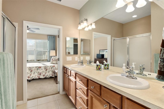 bathroom with tile patterned flooring, vanity, ceiling fan, and a shower with shower door